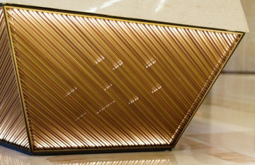Geometric golden panel with internal lighting.